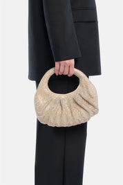 Joan – mini handbag oro | TWENTYFOURHAITCH – indossata dalla modella